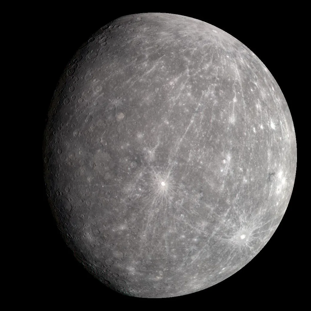 Grey cratered globe of the planet Mercury against black space, photographed by the MESSENGER spacecraft
