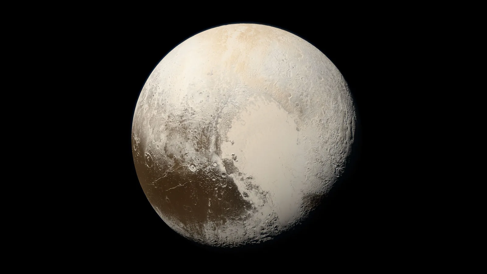 True-color photograph of Pluto taken by NASA New Horizons in 2015, showing the bright heart-shaped Sputnik Planitia